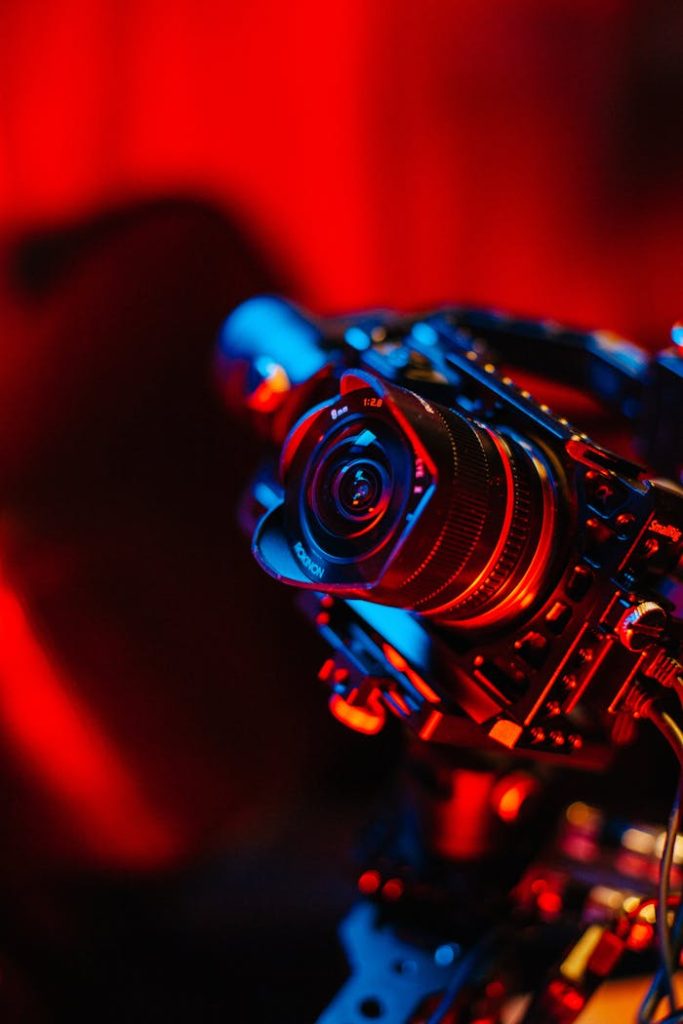 A DSLR camera with vibrant lighting on a photography set.